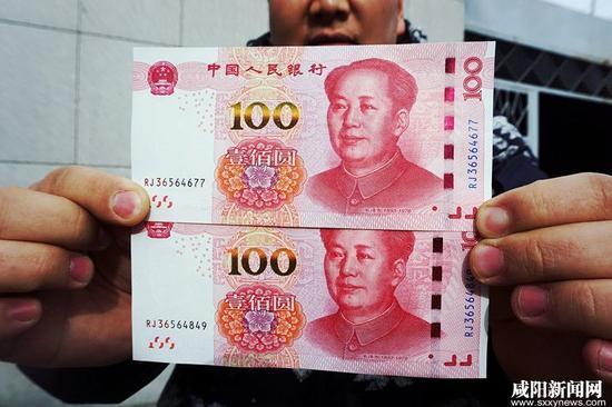 土豪金版百元大钞防伪线有差异 专家称可忽略